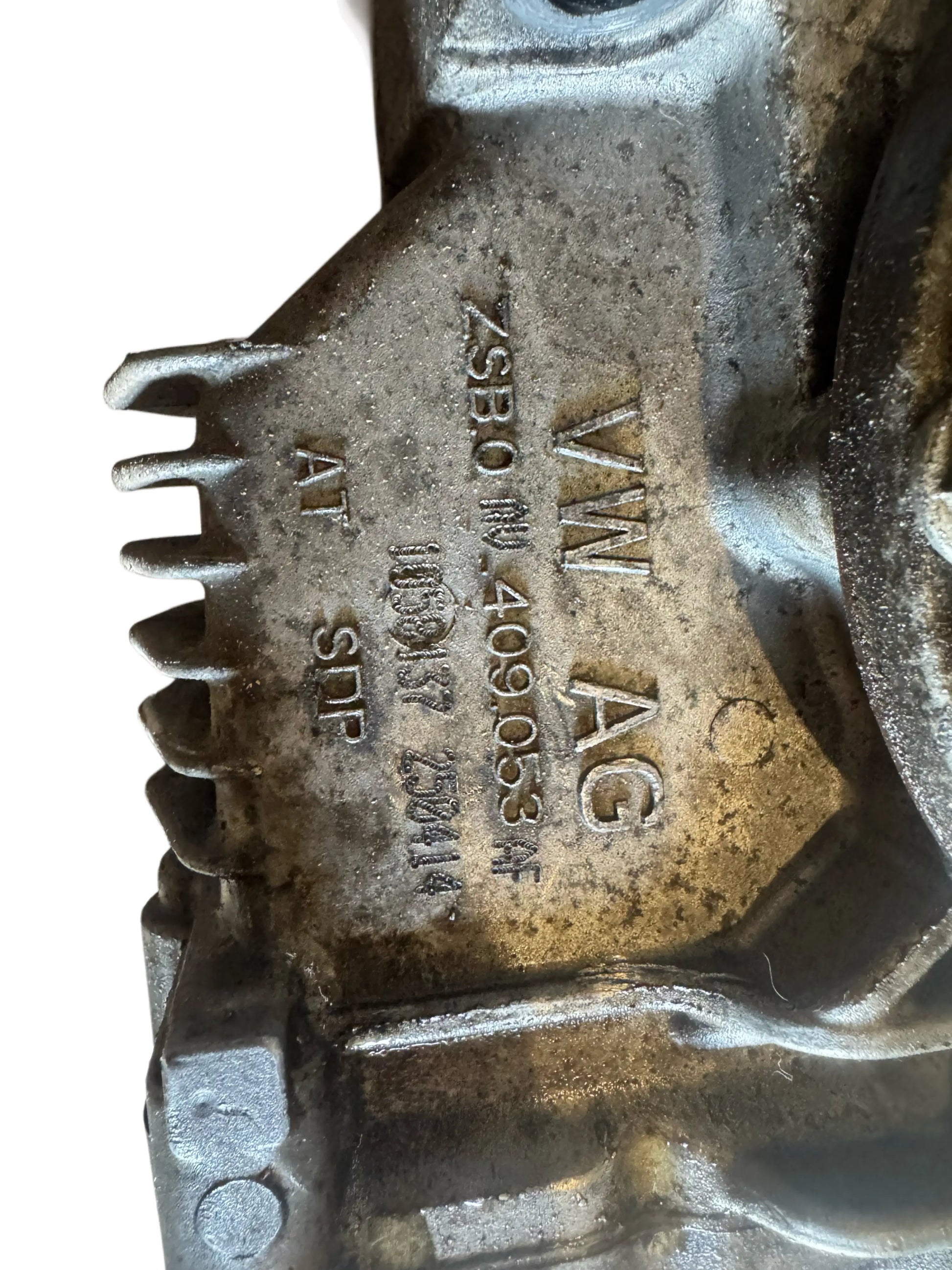 Original OEM 0AV409053AF front differential housing on workbench

