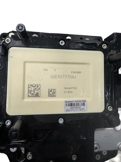 02E927770AJ Complete Gearbox Mechatronics DSG-6 DQ250 top label view showing Volkswagen Group logo, Audi logo, part number 02E927770AJ, TEMIC 00406177A3, production date, and warranty sticker 220762439